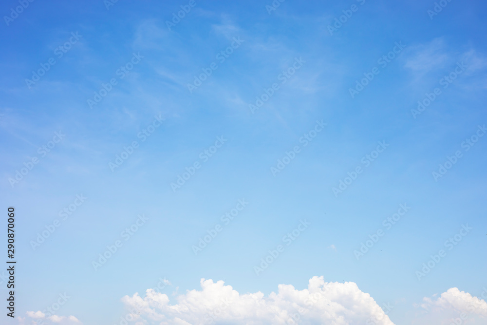 Obraz premium Blue sky background and white clouds soft focus, and copy space