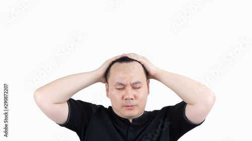 Close up of serious Asian bald man alopecia isolated on white background. Human hair loss solution concept.