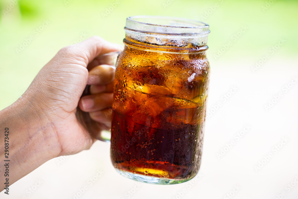 cola cola sparkling water in a glass with ice cola cola sparkling water in a glass with ice