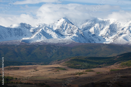 Altai. View of the mountain valley. Snow-capped mountain peaks, glaciers.