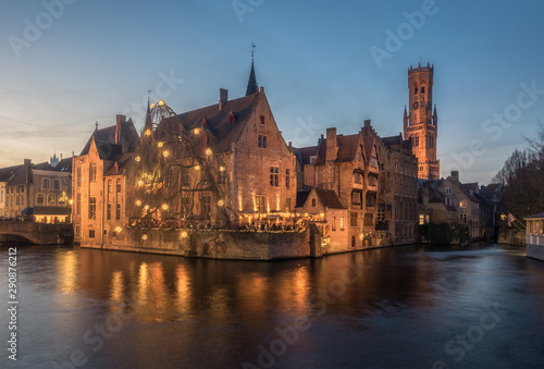 Scenic cityscape with a medieval fairytale town and tower Belfort from the quay Rosary  Rozenhoedkaai  at sunset in Bruges  Belgium