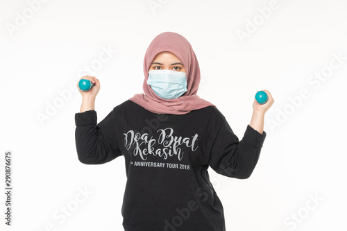 Asian woman wearing face masks due to the haze in situation workup indoor isolated white background photo