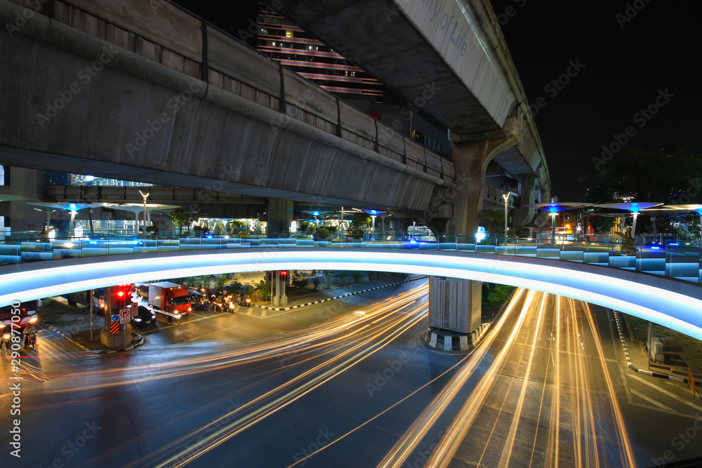 Bangkok,Thailand - 31 October 2017 : Night light with long speed shutter of traffic at MBK, BTS Siam interchange in front of Siam Discovery and Art Museum junction on Halloween night Bangkok,Thailand - 31 October 2017 : Night light with long speed shutter of traffic at MBK, BTS Siam interchange in front of Siam Discovery and Art Museum junction on Halloween night
