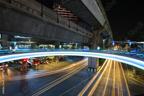 Bangkok,Thailand - 31 October 2017 : Night light with long speed shutter of traffic at MBK, BTS Siam interchange in front of Siam Discovery and Art Museum junction on Halloween night © soultkd