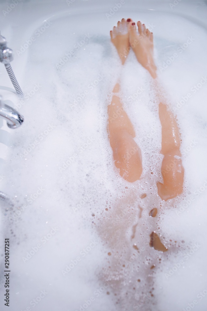 Fototapeta premium woman washing her hands in bathroom