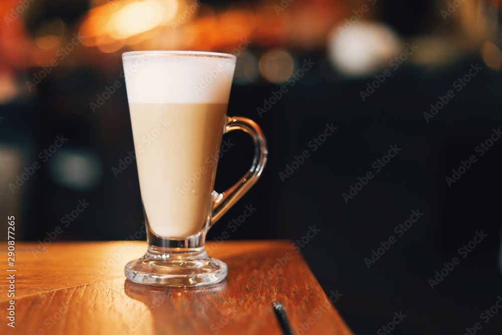 cup of coffee with cream on wooden background cup of coffee with cream on wooden background