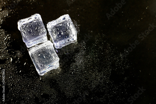 ice cubes on black background. © peterkai