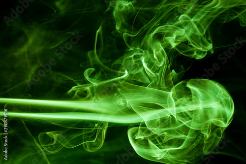 Green smoke movement on black background.