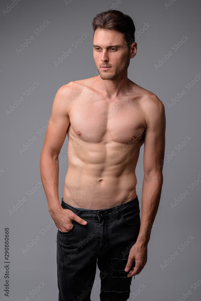 Studio shot of handsome muscular man shirtless