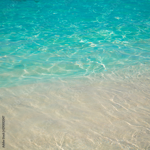 sandy beach and blue sea wave. Beautiful natural background. Tourism and travel.