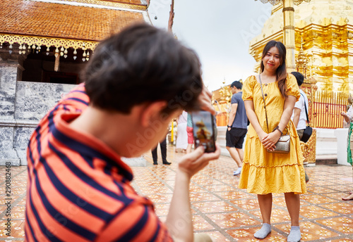 thai tourists taking photos in front of  Wat Phrathat Doi Suthep temple near chiang mai thailand