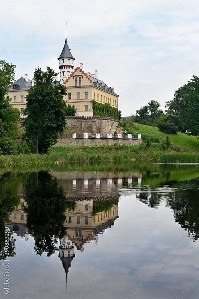 Castle by the lake with reflection in the water.