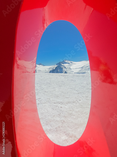 View to the glacier Adamello, Lobbie, Presanella and Pian di Neve through the zero of the 3.000 meters. Arrival of the cableway Presena. Italian Alps photo