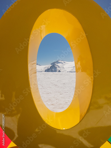 View to the glacier Adamello, Lobbie, Presanella and Pian di Neve through the zero of the 3.000 meters. Arrival of the cableway Presena. Italian Alps photo