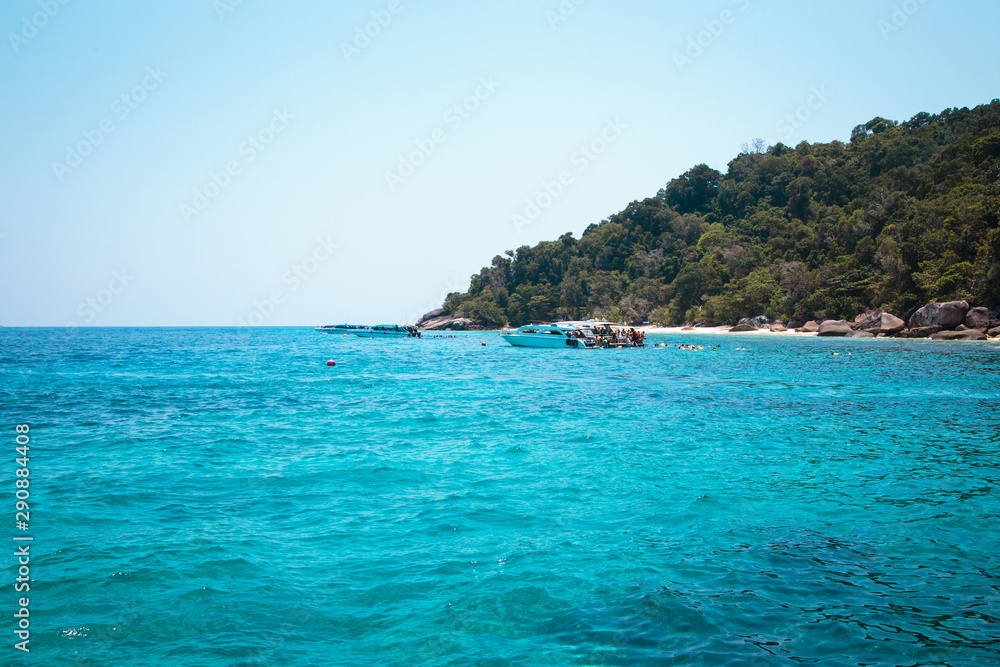 Similan Islands, Andaman Sea, Thailand, March 18, 2018: National park, beautiful blue sea. White boats with tourists.