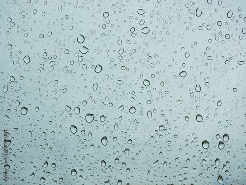 Rain droplets on a car's window on a rainy day - driver's perspective