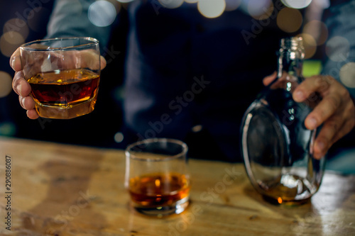 Fototapeta Naklejka Na Ścianę i Meble -  glass of brandy and cigar on table