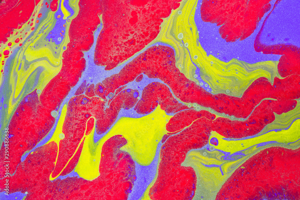 Free flow of yellow and blue colors creates decorative stone effect. Abstract background or texture. Acrylic Fluid Art