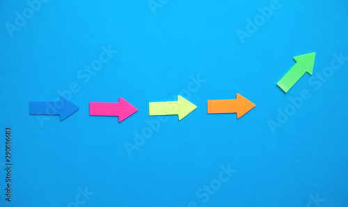 Colorful arrows on blue background.