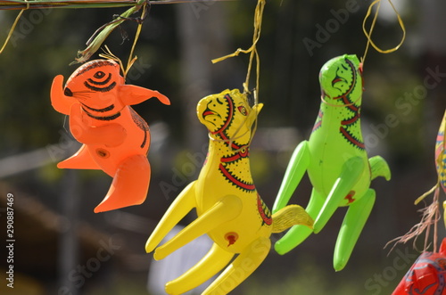 On your marks; Get set Go! - Toy animals hung on road side shop