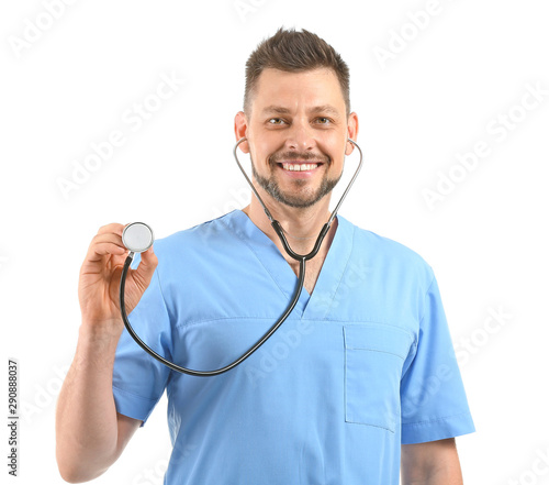 Smiling male doctor in blue...