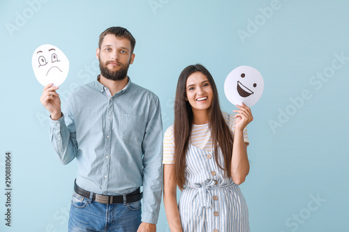 Happy couple holding sheets...