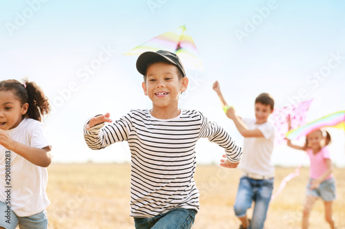 Little children flying kite...