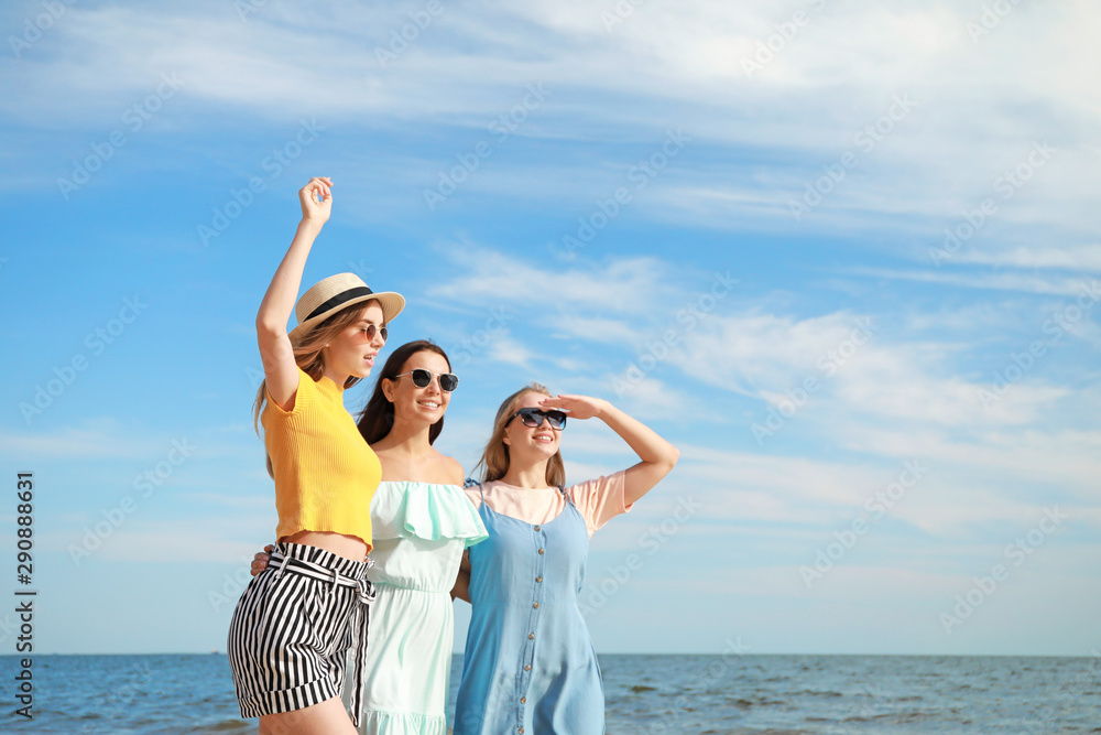 Happy young women on sea beach at resort Happy young women on sea beach at resort