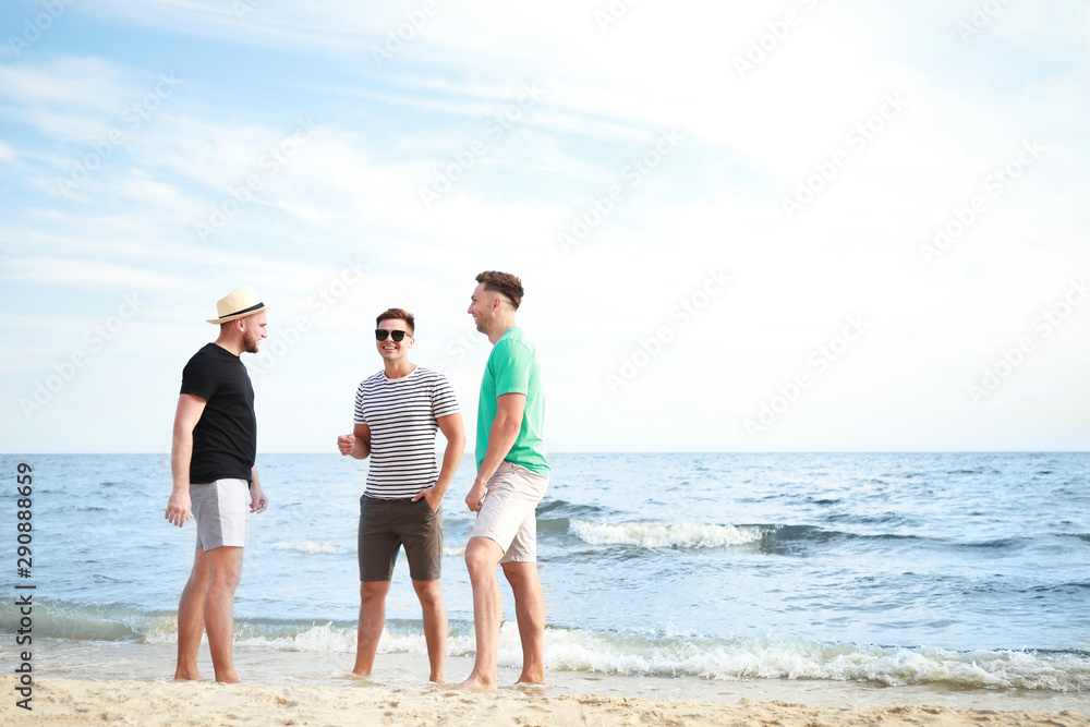 Happy friends on sea beach at resort Happy friends on sea beach at resort