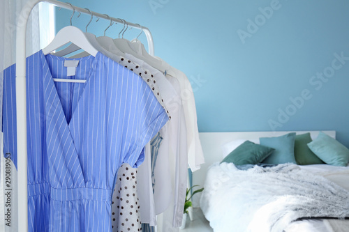 Rack with hanging clothes i...