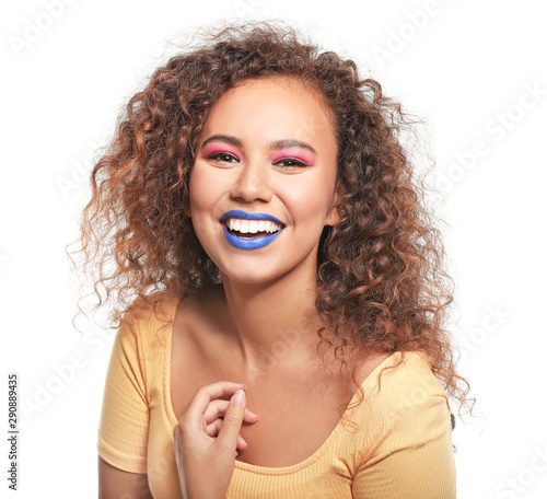 Portrait of fashionable young African-American woman on white background