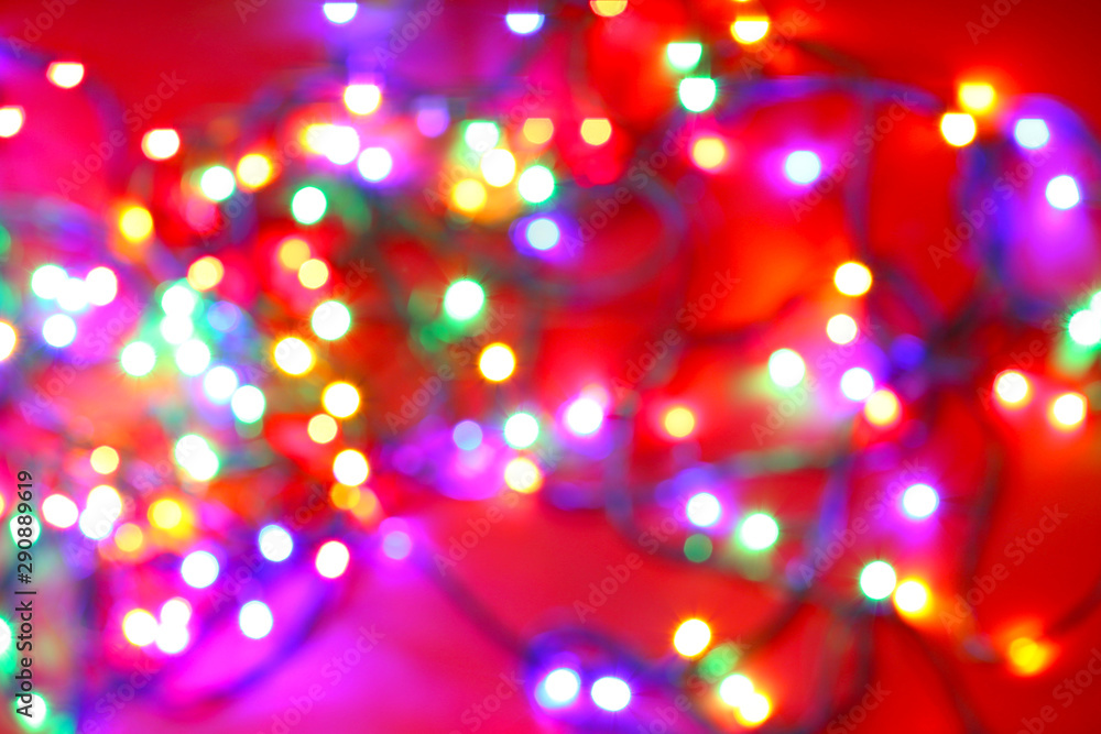 Blurred Christmas lights on color background Blurred Christmas lights on color background