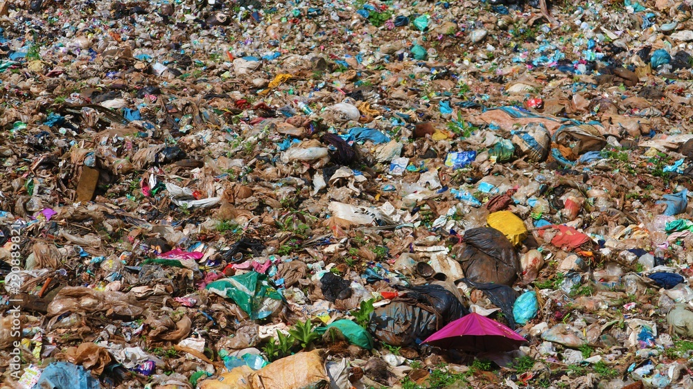 A large pile of garbage that has been dumped for a long time A large pile of garbage that has been dumped for a long time