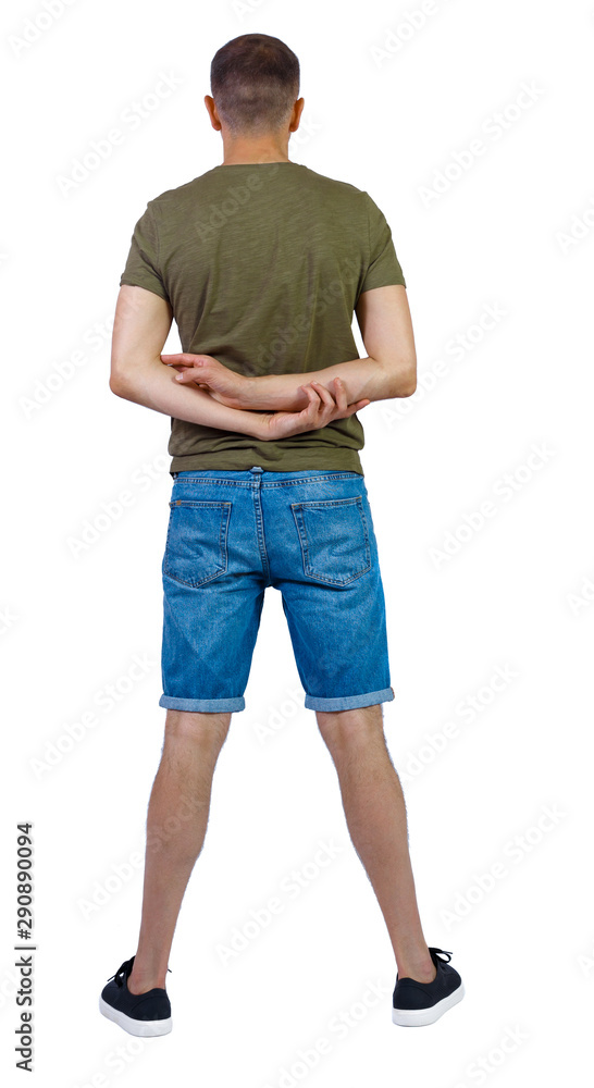 Back view of young manin shorts looking. Back view of young manin shorts looking.