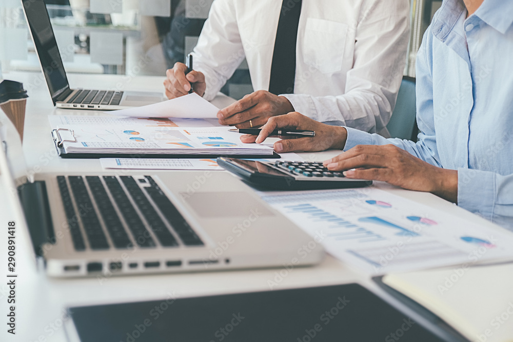 Administrator business man financial inspector and secretary making report calculating balance. Internal Revenue Service checking document. Audit concept Administrator business man financial inspector and secretary making report calculating balance. Internal Revenue Service checking document. Audit concept