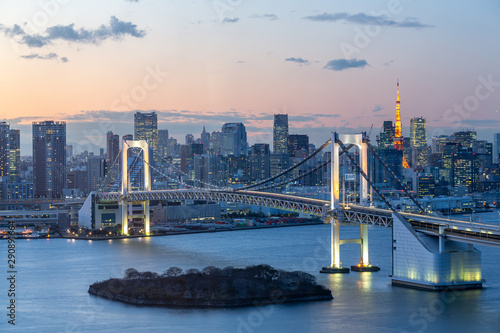 Sunset of Tokyo Bay with Rainbow Bridge in Odaiba city skyline.