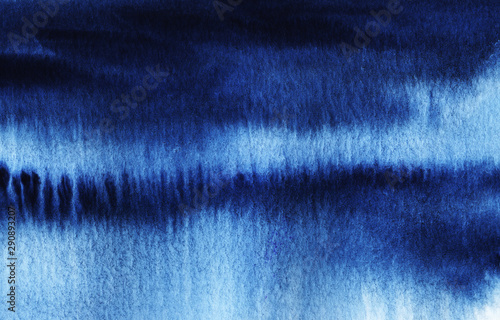 Abstract watercolor background. Streaks of dark blue ink texture paper. spilled horizontal spots. Deep blue color. Gradient from dark to light. Night sky or deep sea. Hand drawn illustration