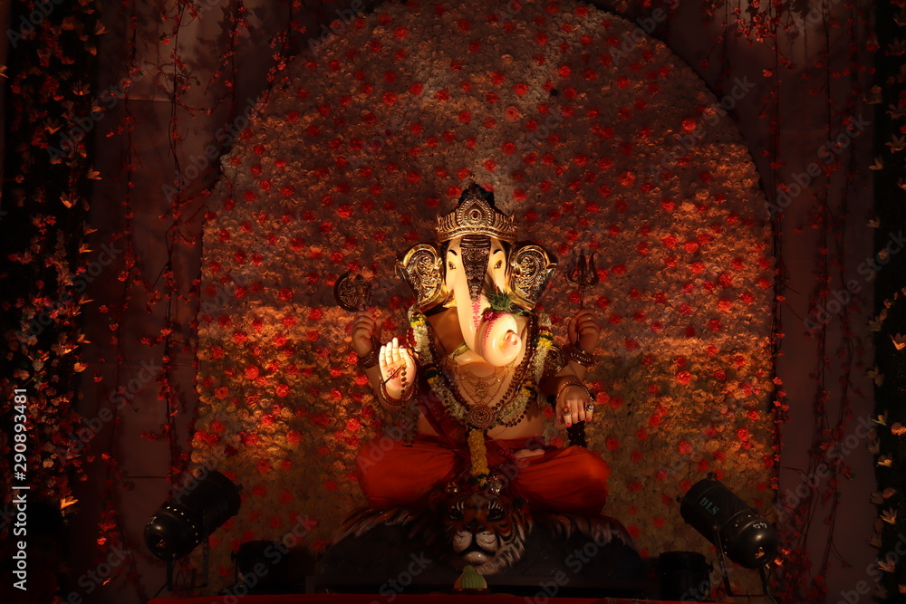 Decorated idol of Lord Ganesha with black background. Ganesh  chaturthi/ganeshotsav festival. Stock Photo | Adobe Stock