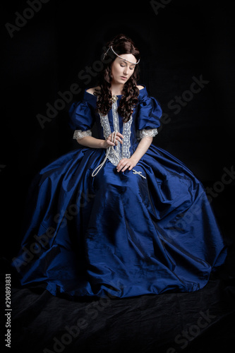 Renaissance woman in blue silk dress