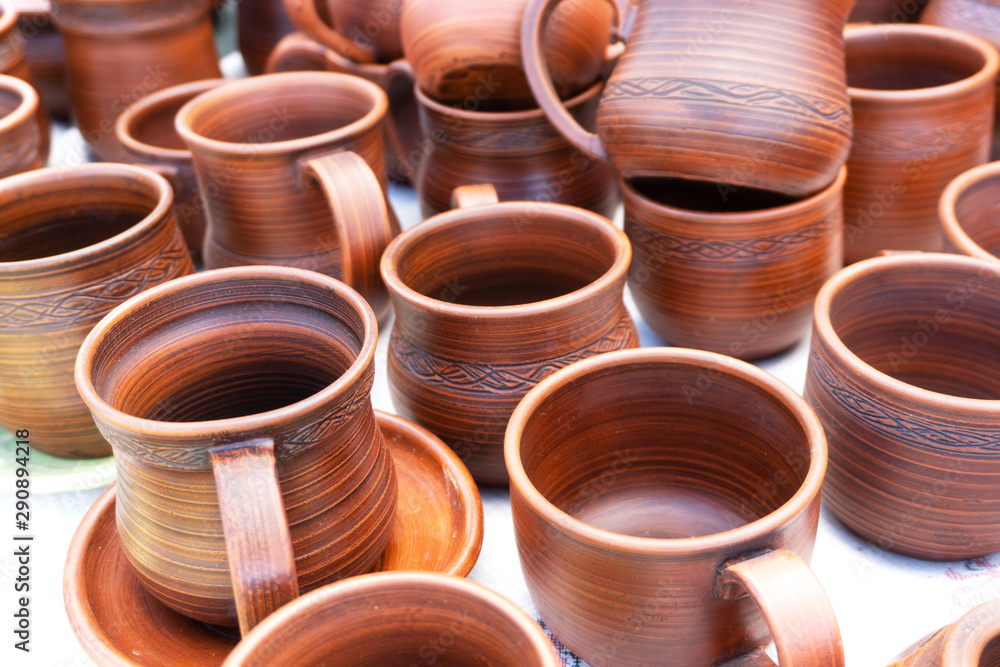 Rustic handmade ceramic clay brown terracotta cups souvenirs. Rustic handmade ceramic clay brown terracotta cups souvenirs.