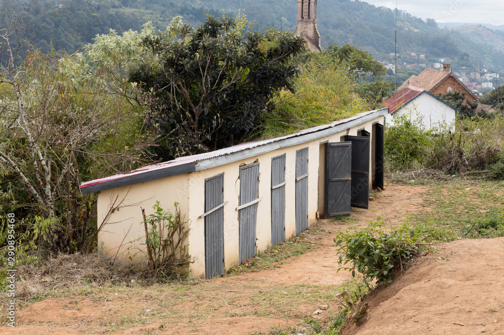 Building with three toilets in a village on Madagascar