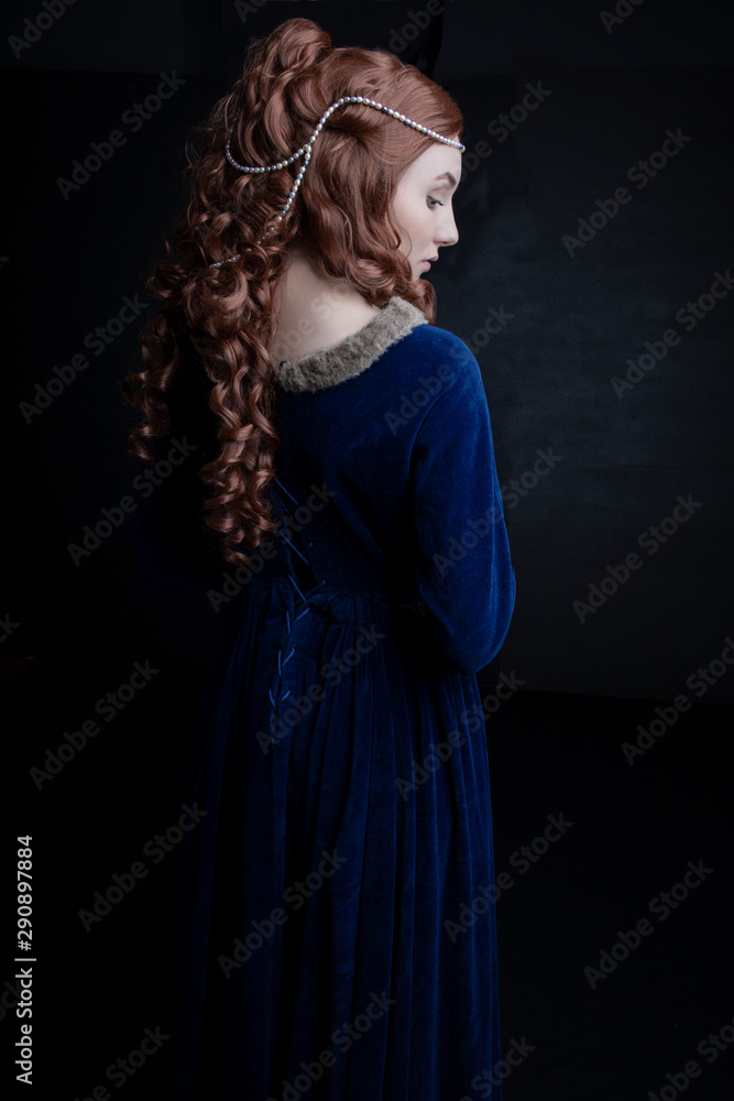 Medieval woman in blue velvet dress