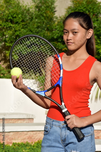 Unemotional Athletic Diverse Girl Tennis Player With Tennis Racket © dtiberio