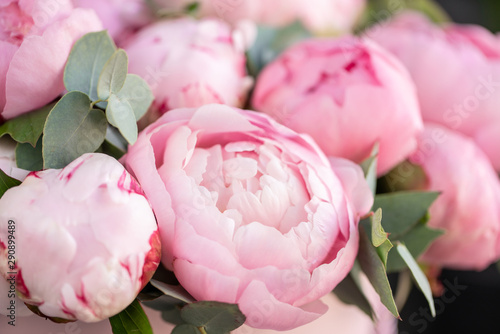 Fototapeta Naklejka Na Ścianę i Meble -  Close-up of flowers Pink peonies . Beautiful peony flower for catalog or online store. Floral shop concept . Beautiful fresh cut bouquet. Flowers delivery