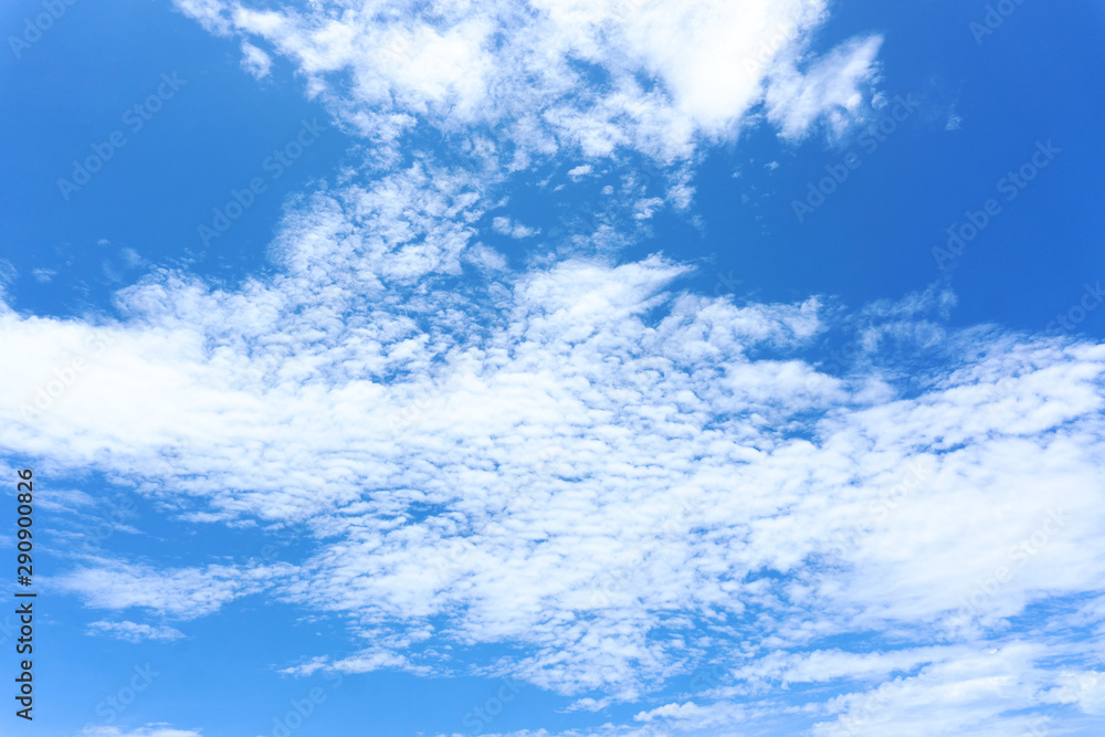 Beautiful view of white fluffy clouds on a clear blue sky background. Nature weather on the vast cloud blue sky. Sky daylight in summer. Natural background with copy space. Element of design.