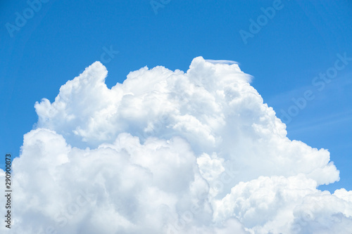 Beautiful view of white fluffy clouds on a clear blue sky background. Nature weather on the vast cloud blue sky. Sky daylight in summer. Natural background with copy space. Element of design.