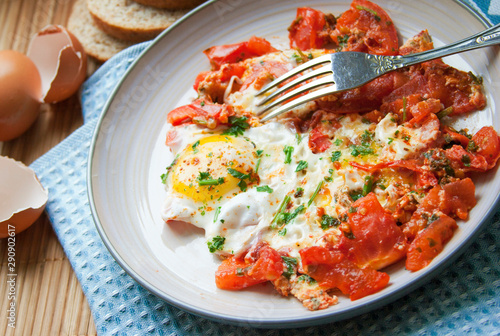 Fried eggs and tomatoes for breakfast