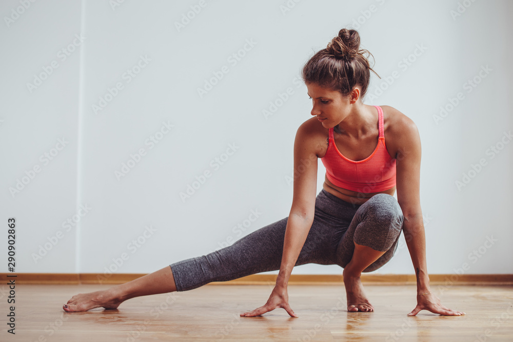 Young female woman workout at home Young female woman workout at home