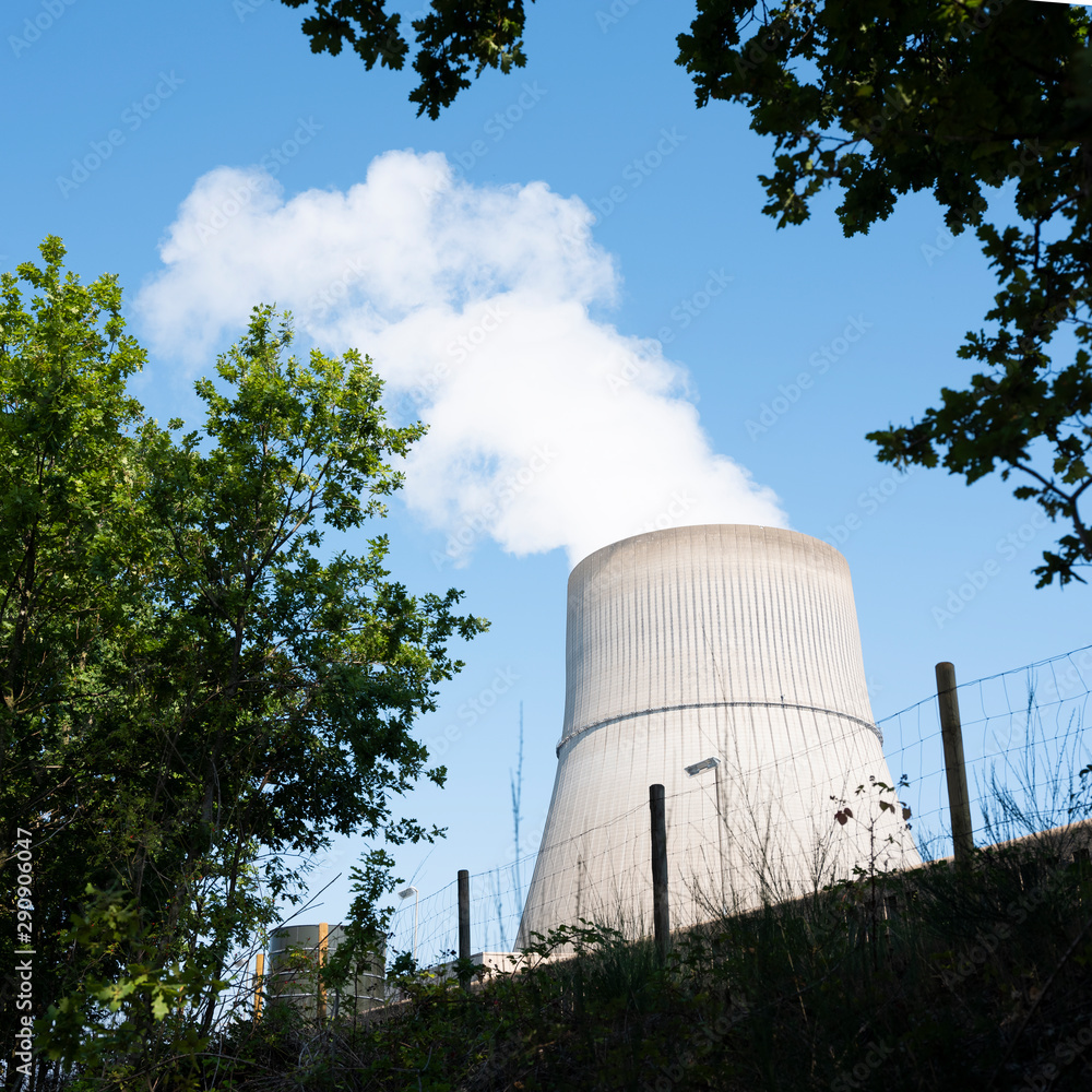 steam and blue sky above large chimney of nuclear power plant near lingen in lower saxony steam and blue sky above large chimney of nuclear power plant near lingen in lower saxony