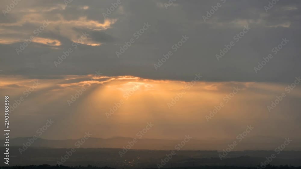 Time-Lapse of Sunrays With Storm Cloud During Sunset Time-Lapse of Sunrays With Storm Cloud During Sunset